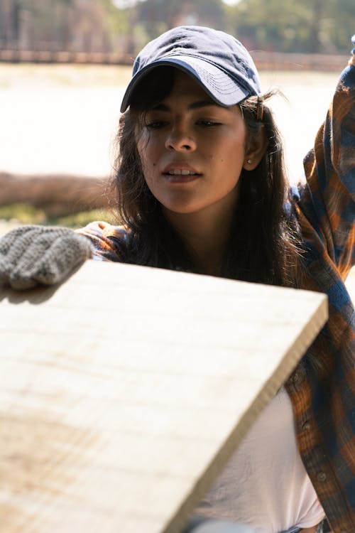 Woman holding a Wood Plank 