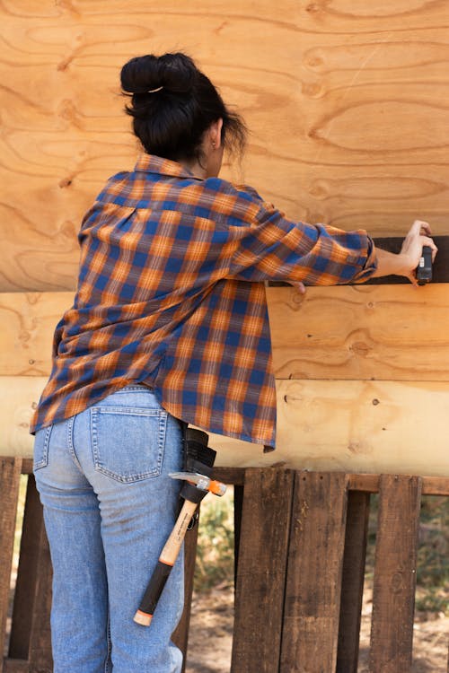 Free Back View of a Carpenter Working Stock Photo