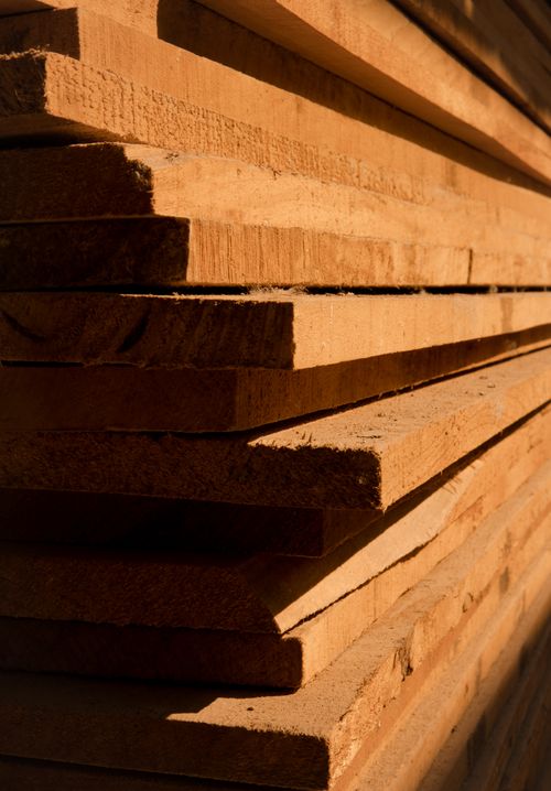 Stacked wood planks with sunlight and shadow
