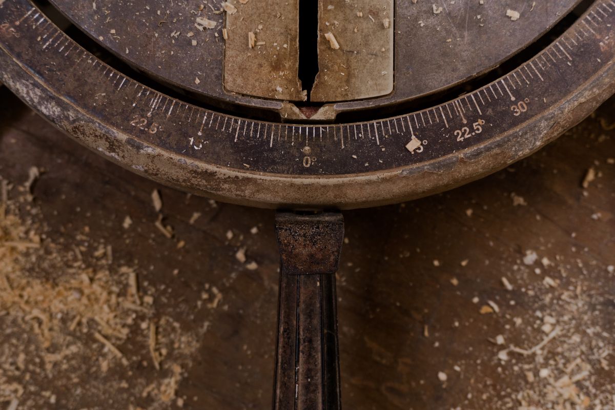 vintage handheld mechanical tally counter on wood