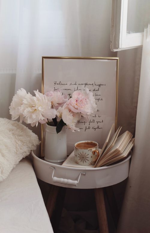 Free A serene still life featuring peonies, an open book, and a coffee mug in a relaxing setting. Stock Photo