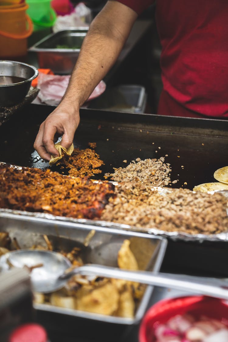 Cooking Of Tacos On A Large Pan 