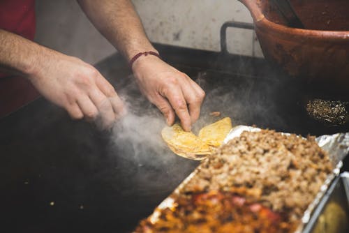 Free Cooking of Tacos on a Large Pan  Stock Photo