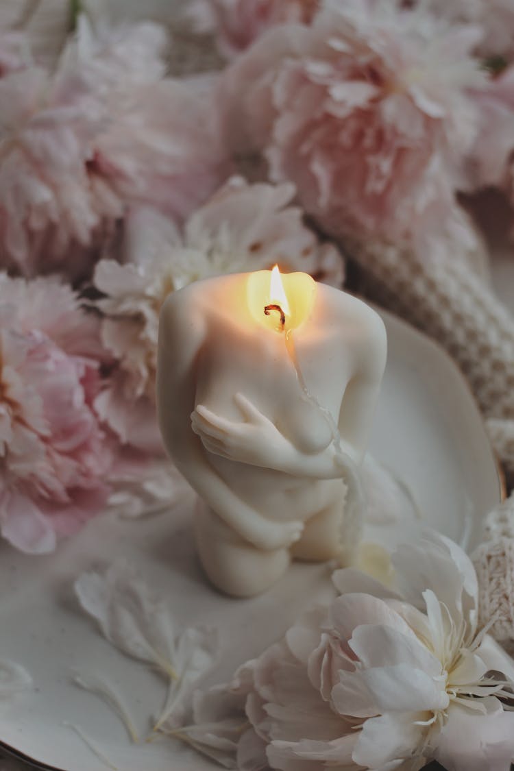 Lighted Candle With Melting Of Its Wax