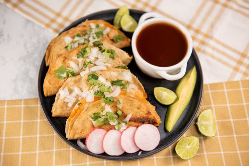 Free Plate of authentic Mexican street tacos garnished with cilantro, onions, and served with lime wedges and salsa. Stock Photo