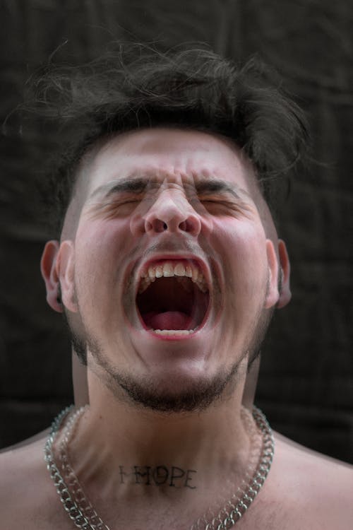 Free Close Up Shot of a Man Screaming Stock Photo