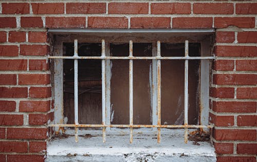 White Metal Railings on the Brick Wall