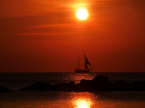 Sailboat on the Ocean during Sunset