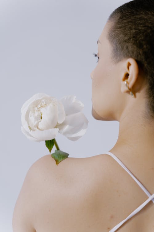 Woman Holding White Flower
