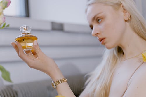 Woman Holding a Perfume