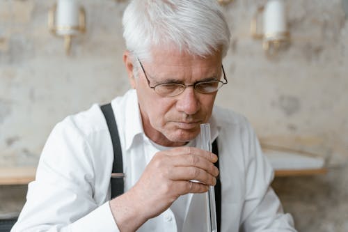 A Man in Holding a Test Tube