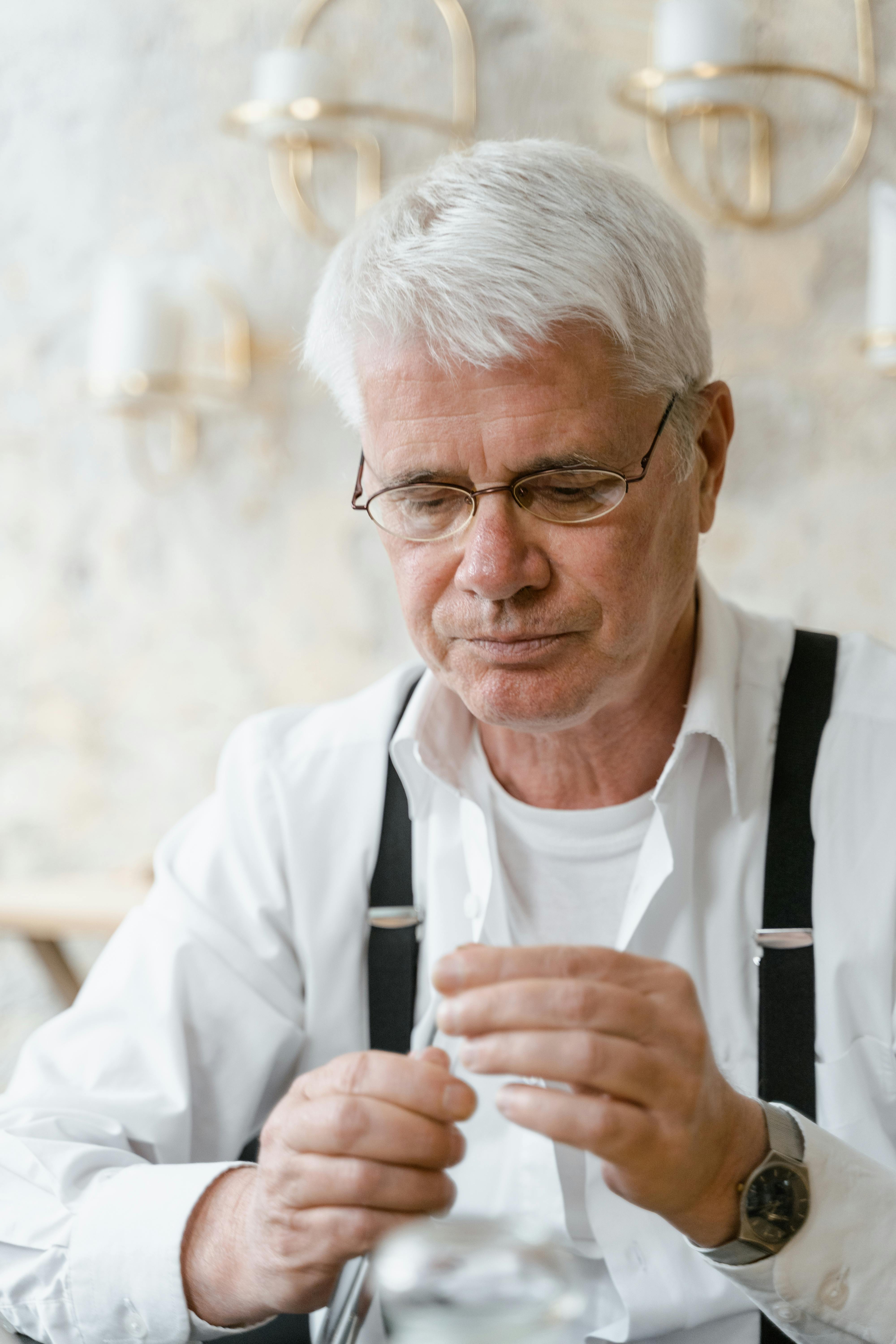 man in white long sleeve shirt wearing eyeglasses