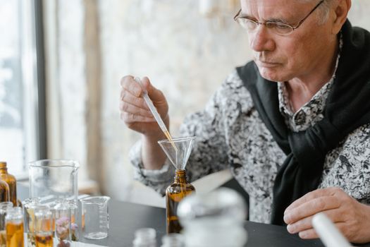 A Man Holding a Dropper