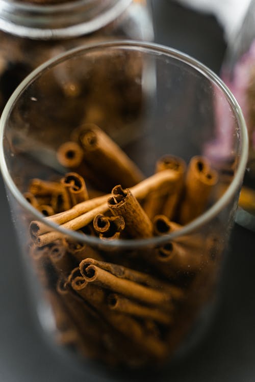 Free Brown Cinnamon Sticks in Clear Glass Stock Photo