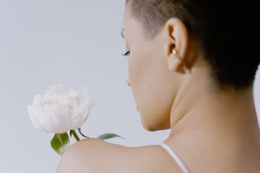 White Flower on a Woman's Shoulder