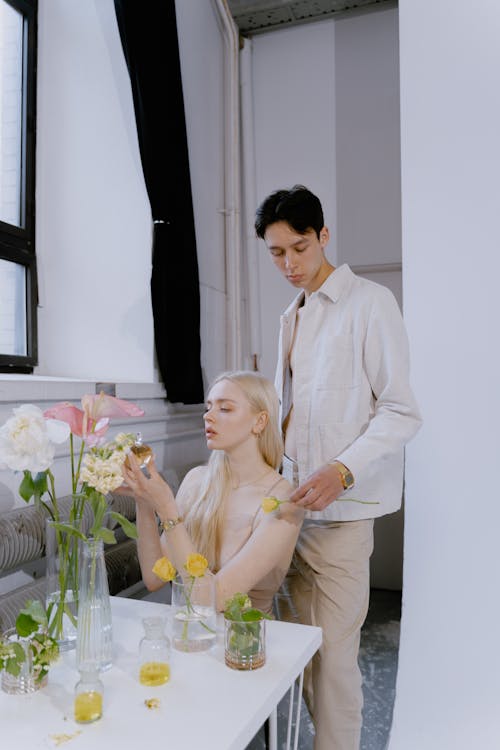 Youthful Young Couple in front of Flowers