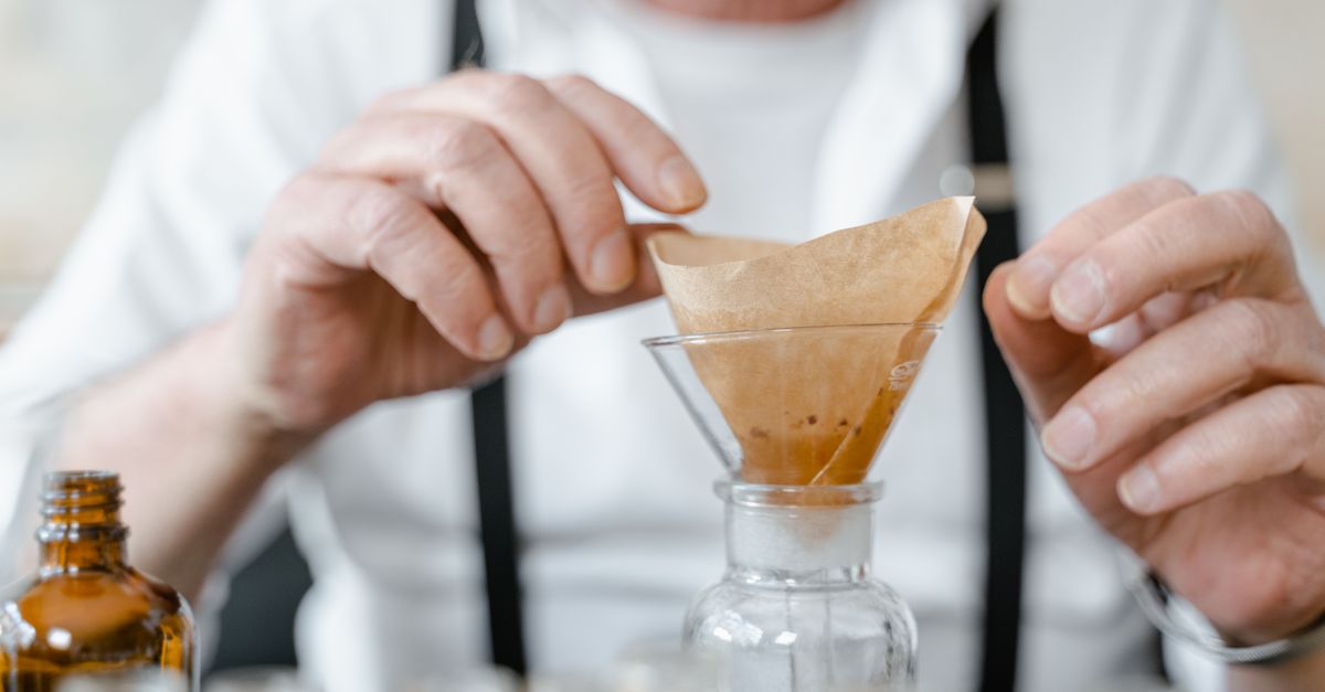 Magnifying glass beside a funnel representing how advanced search filters broad results into precise findings
