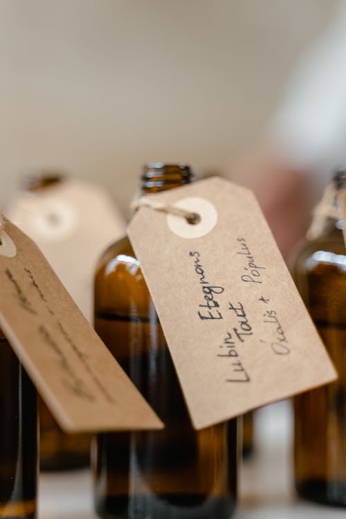 Brown Glass Bottles with Liquid and Tags