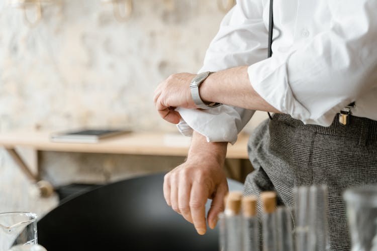 A Person Rolling Up His Sleeves