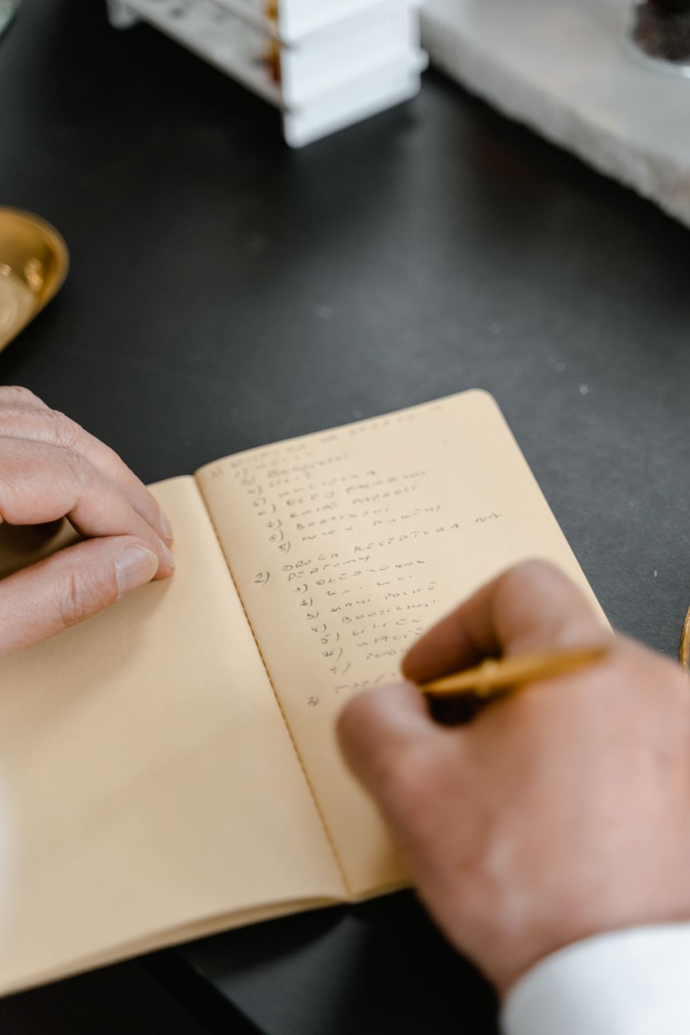 A Close-Up Shot of a Person Taking Notes on a Notebook ยท Free Stock Photo