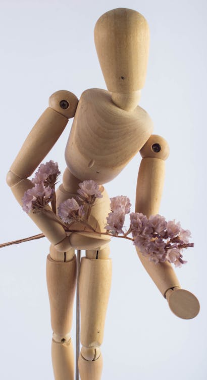 免費 棕色木製人形裝飾 圖庫相片