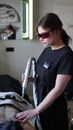 Woman in Black Crew Neck T-shirt Wearing Sunglasses Holding White and Black Stick