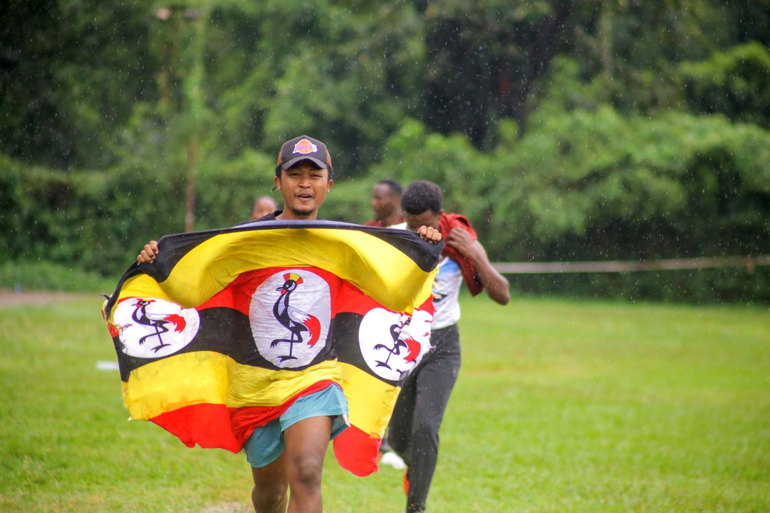 Free Man Running Holding a Flag Stock Photo