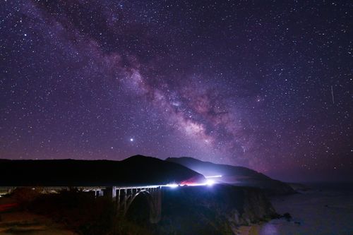 Free Night sky showcasing the Milky Way above Bixby Creek Bridge in Monterey, California. Stock Photo