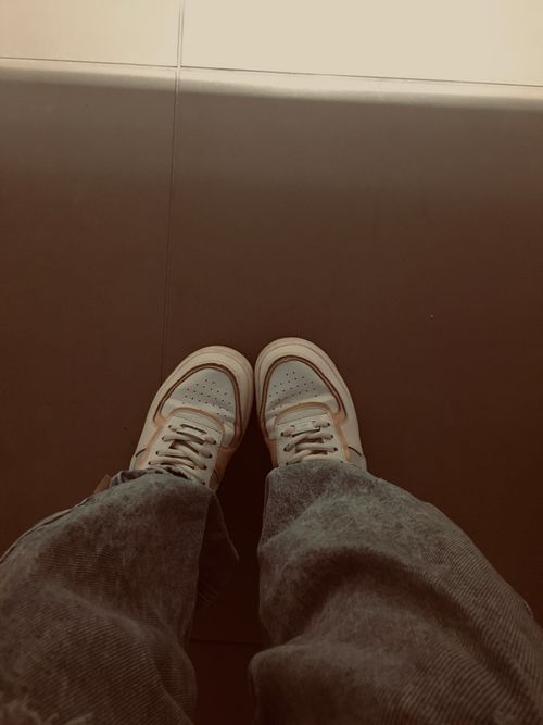 Free Top-down view of casual sneakers with a muted aesthetic in Valledupar, Colombia. Stock Photo