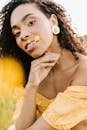 Woman in Yellow Off Shoulder Dress With White Flower on Her Ear