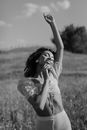Grayscale Photo of Woman in White Dress