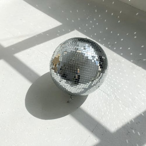 Silver Ball on White Surface