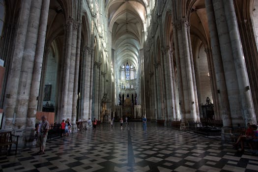 Explore the grandeur of a Gothic cathedral's interior with towering columns and intricate details.