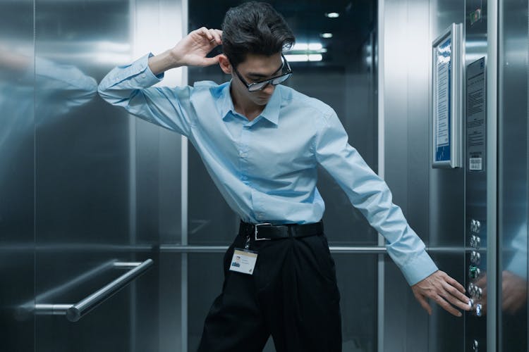 Man Posing Inside The Elevator 