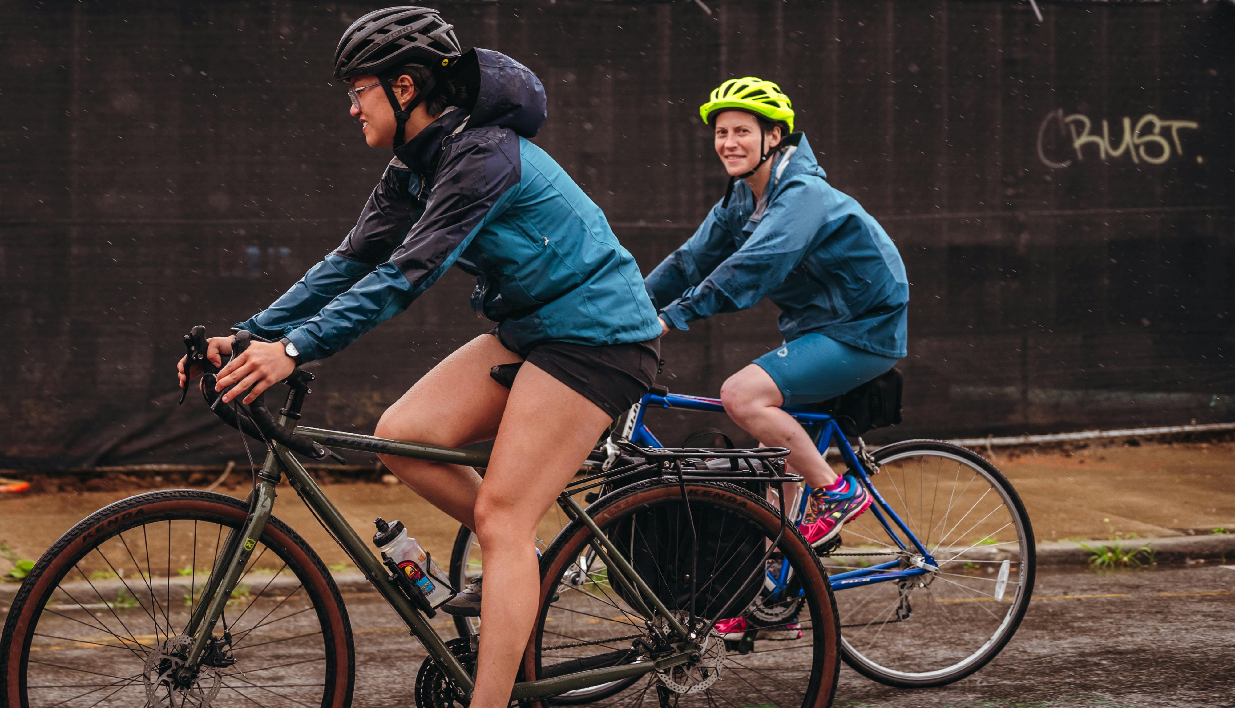 Free Women Riding Bicycles on the Street Stock Photo