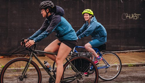 Free Women Riding Bicycles on the Street Stock Photo