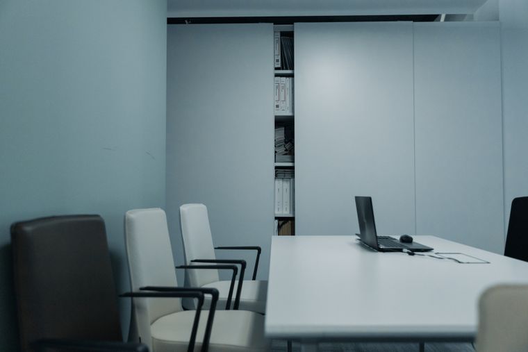 Empty meeting room with chairs and a laptop, photo by cottonbro studio on Pexels