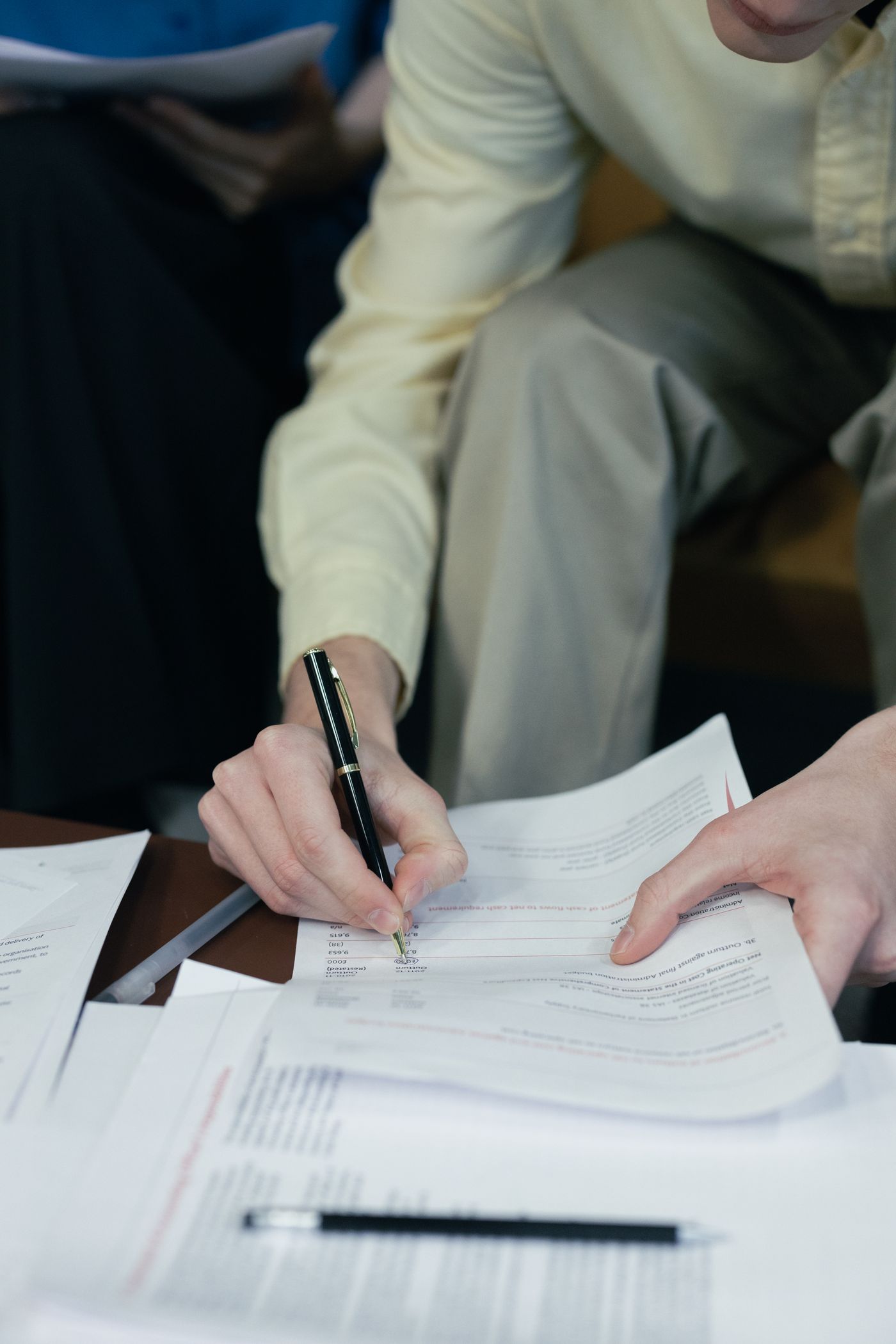 Professional mobile notary appointment with documents being reviewed and signed