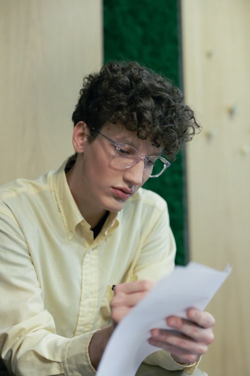 Close-up Photo of Man writing on Paper · Free Stock Photo