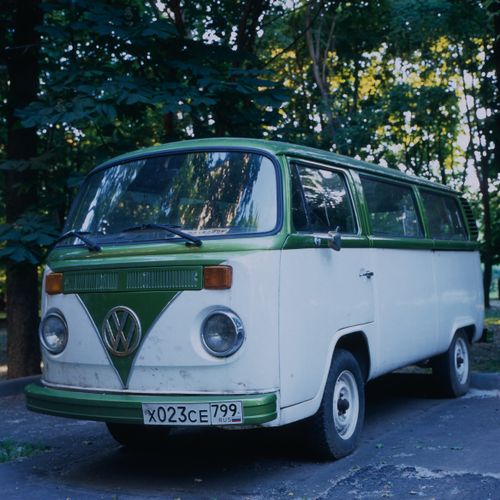 Free Capture of a classic vintage Volkswagen van parked outdoors with a retro feel. Stock Photo
