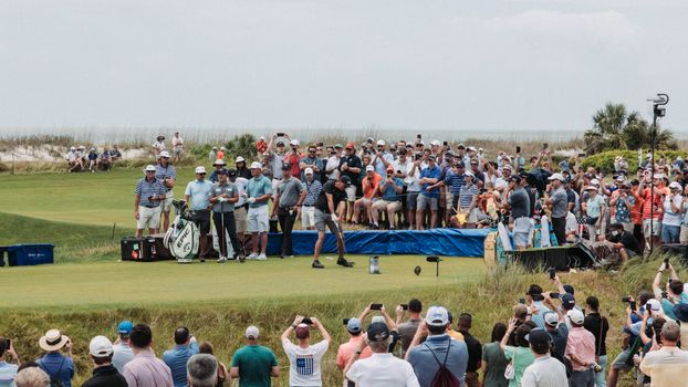 Photo by andrew shelley Golfers and fans gather for a thrilling tournament at Kiawah Island's lush course.