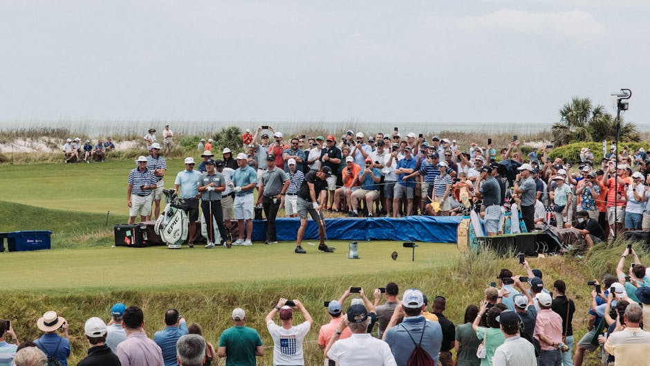 Golfers and fans gather for a thrilling tournament at Kiawah Island's lush course.
