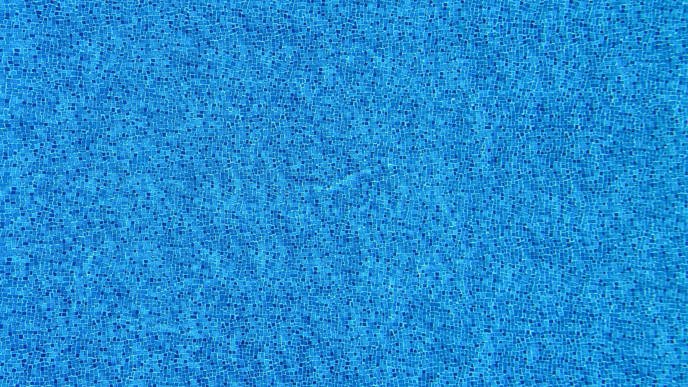 Blue mosaic swimming pool tile surface