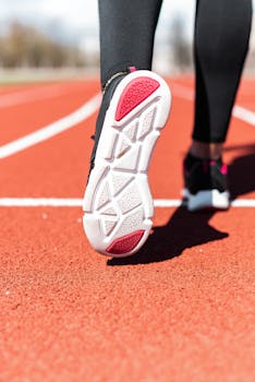 High-quality image of a running shoe sole on an athletic track.