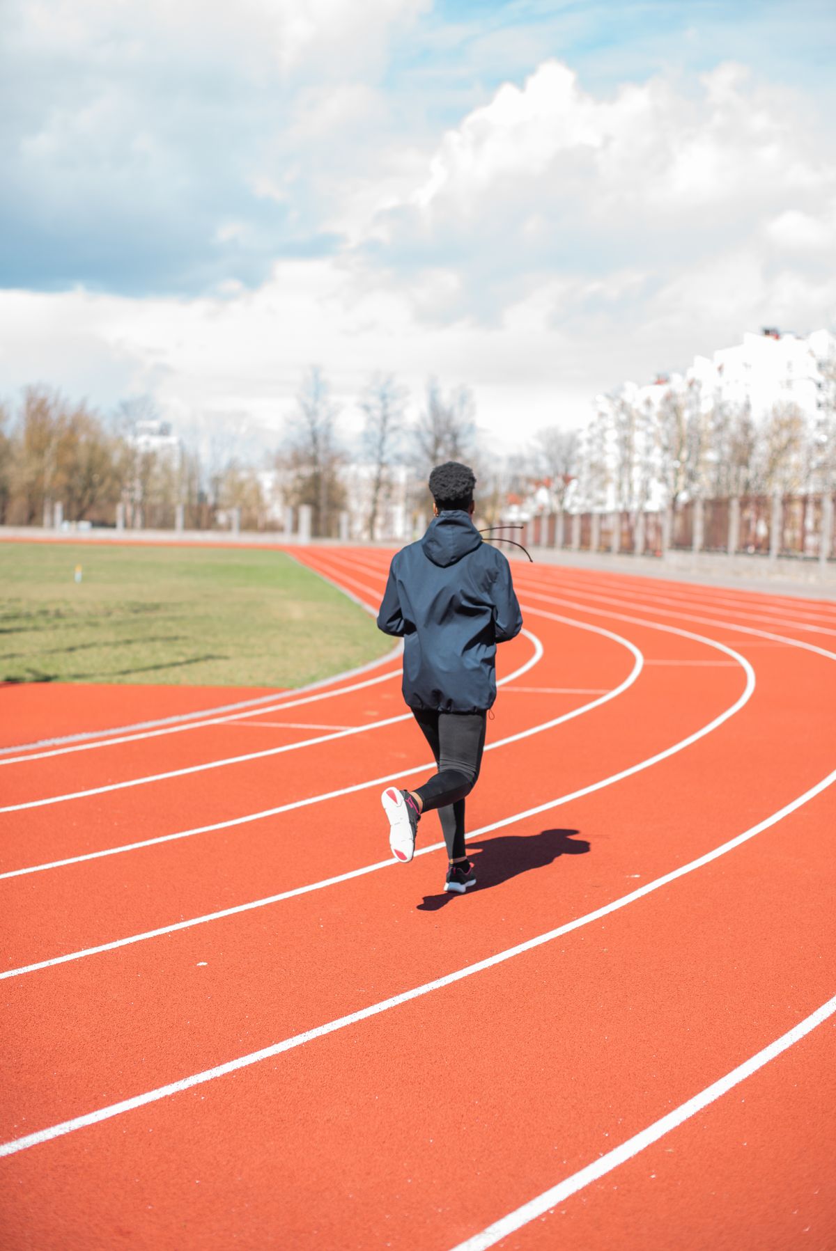 Person running on a track during an interval training session