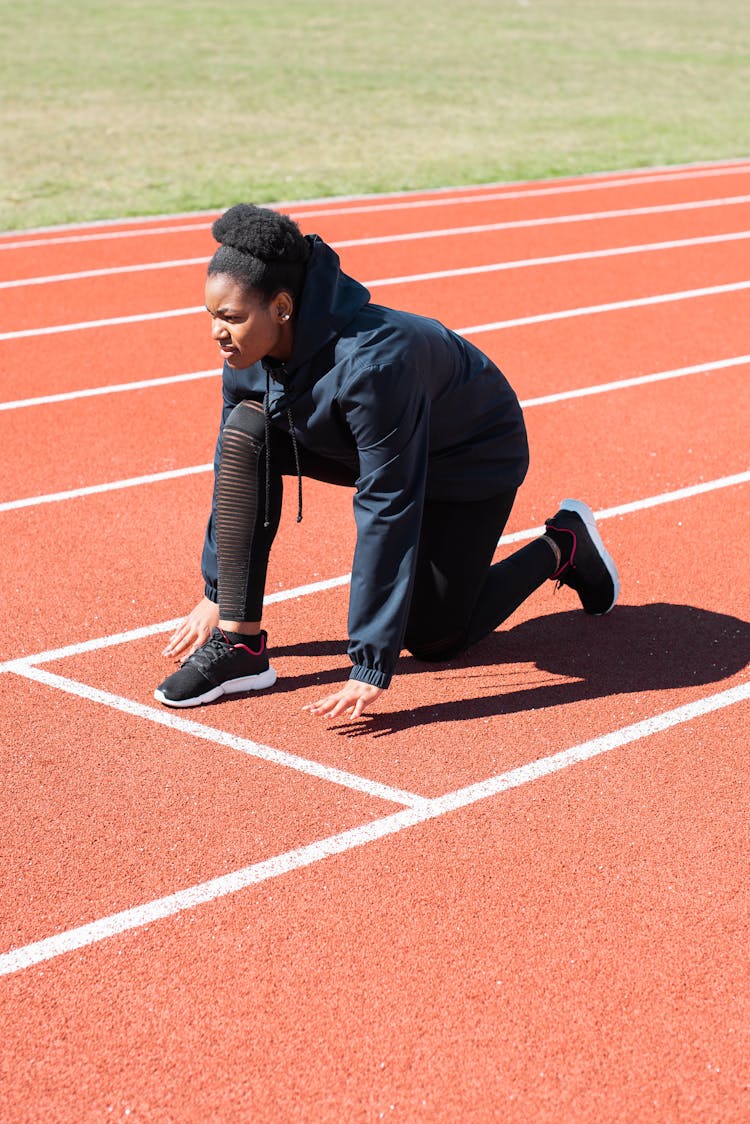 Woman On Starting Position On The Track