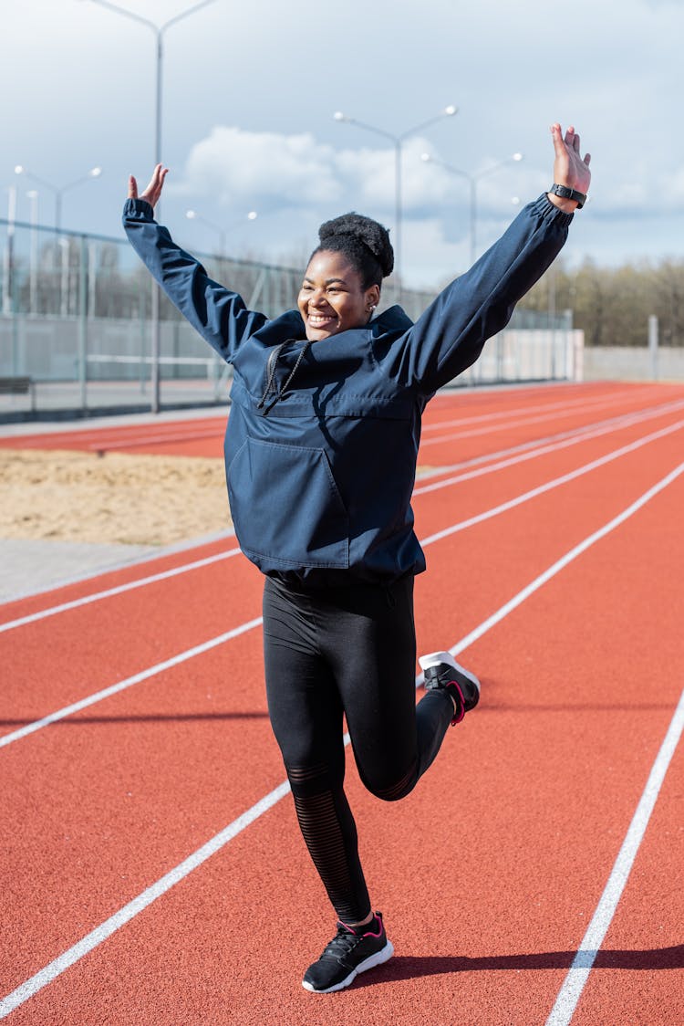 A Happy Woman Raising Her Hands