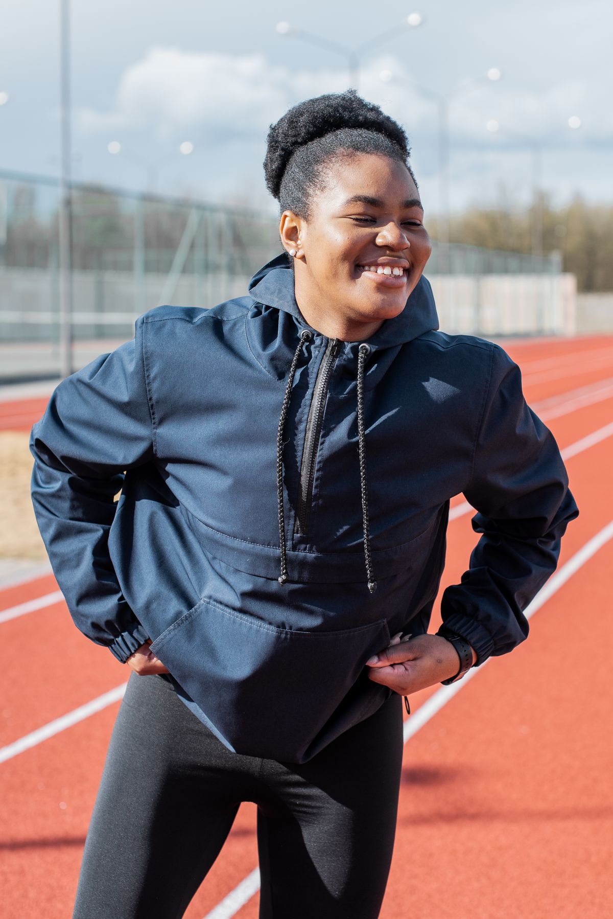 Woman wearing a sporty quarter-zip pullover travel outfit