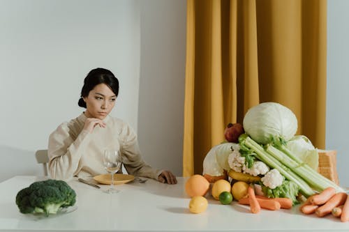 A Woman Looking at Assorted Vegetables