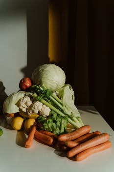 A vibrant selection of fresh, organic vegetables on a table in natural light.